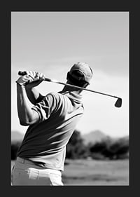 Black and white golfer swinging with club against bright sky-5