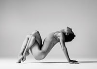 Black and white photo art of woman in yoga position against light background-7