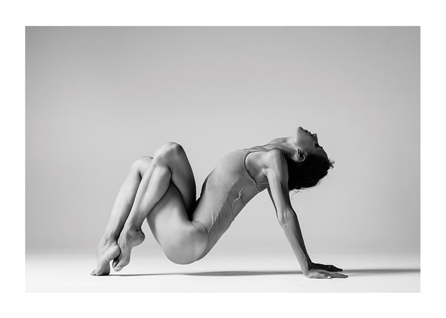 Black and white photo art of woman in yoga position against light background-12