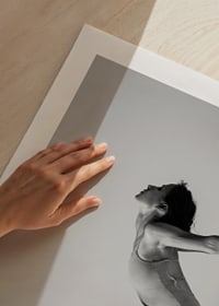 Black and white photo art of woman in yoga position against light background-9