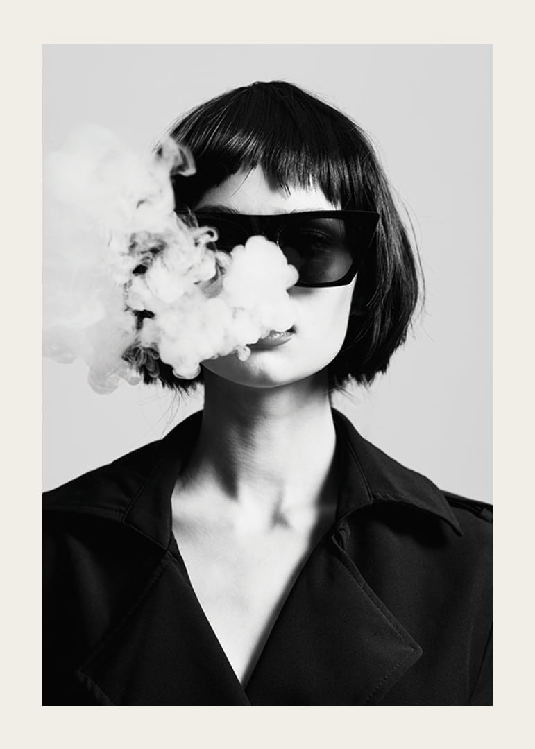 Black and white portrait of woman with sunglasses and smoke-12