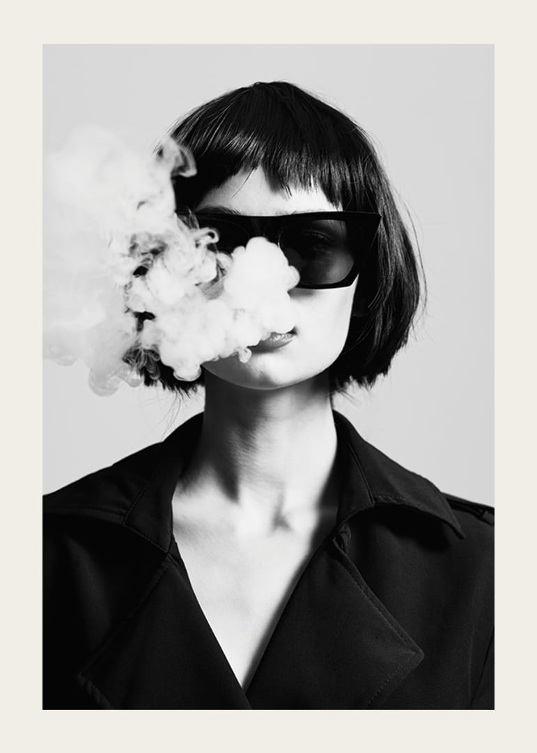 Black and white portrait of woman with sunglasses and smoke-12