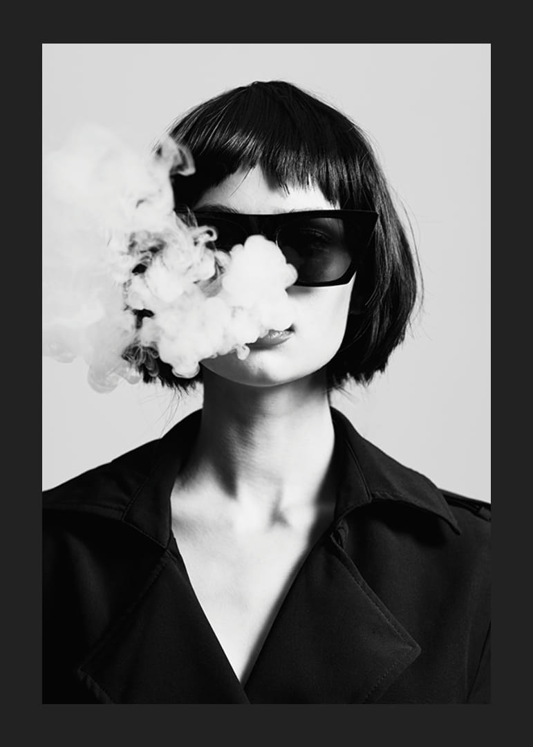 Black and white portrait of woman with sunglasses and smoke-12