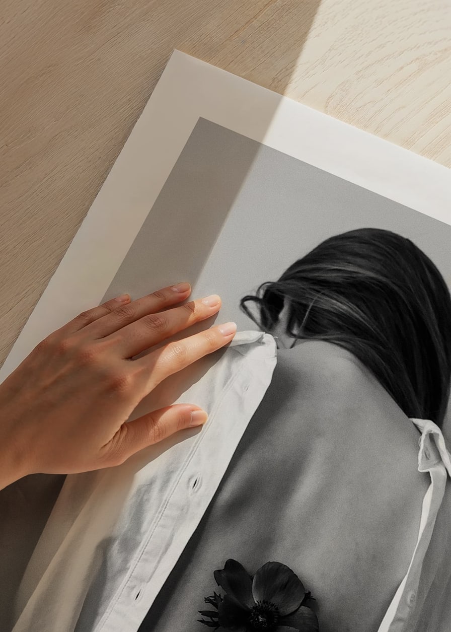 Black and white photograph of woman with flower behind her back-12
