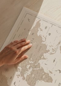 Stylish world map in beige tones with animals and symbols-3