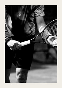 Black and white photo of tennis player with racket and ball-5
