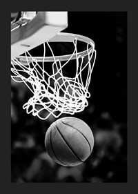 Black and white close-up of basketball going through basket-1