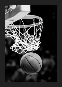 Black and white close-up of basketball going through basket-1