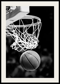 Black and white close-up of basketball going through basket-4