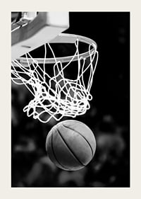 Black and white close-up of basketball going through basket-5
