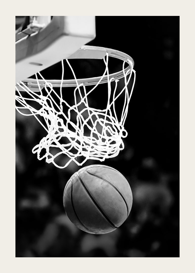 Black and white close-up of basketball going through basket-12