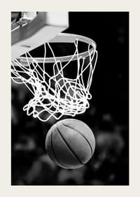Black and white close-up of basketball going through basket-5