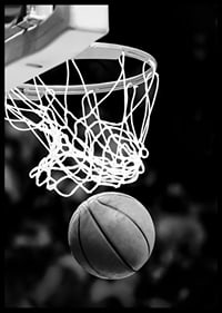 Black and white close-up of basketball going through basket-6