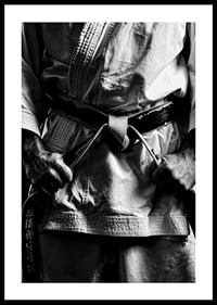 Black and white close-up of person in martial arts outfit with black belt-2