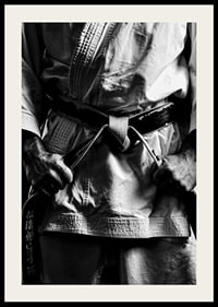 Black and white close-up of person in martial arts outfit with black belt-4