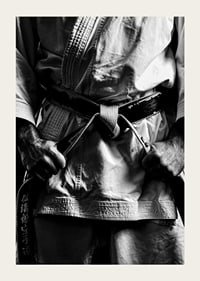 Black and white close-up of person in martial arts outfit with black belt-5