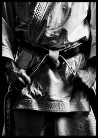 Black and white close-up of person in martial arts outfit with black belt-6