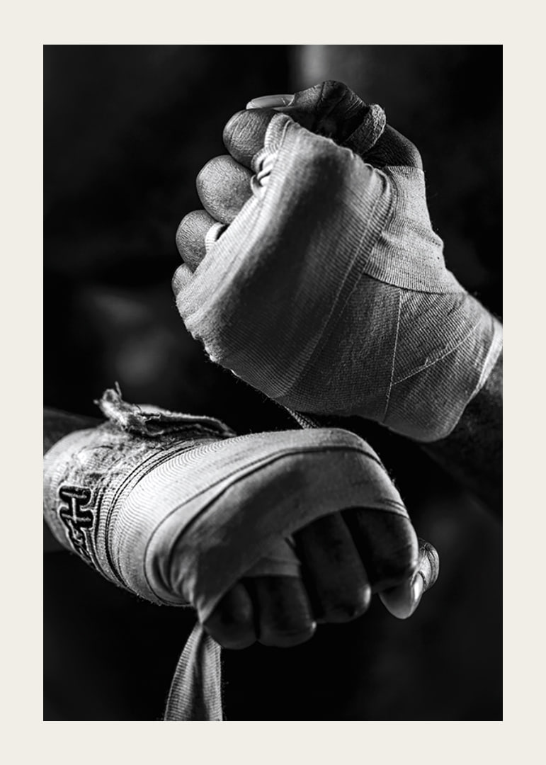 Black and white close-up of hands tied with boxing bandages-12