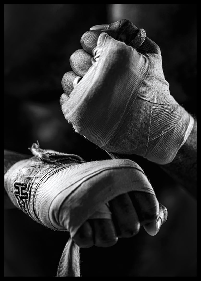 Black and white close-up of hands tied with boxing bandages-12