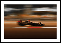 Formula 1 car at high speed with blurred background in warm colors-0