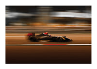 Formula 1 car at high speed with blurred background in warm colors-1