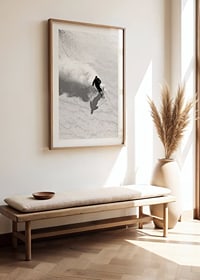 Black and white skier moving down snow-covered mountainside-8
