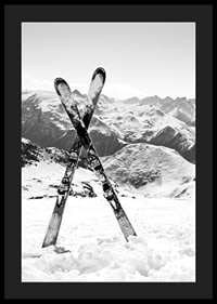 Black and white photo of crossed skis in snowy alpine landscape-4