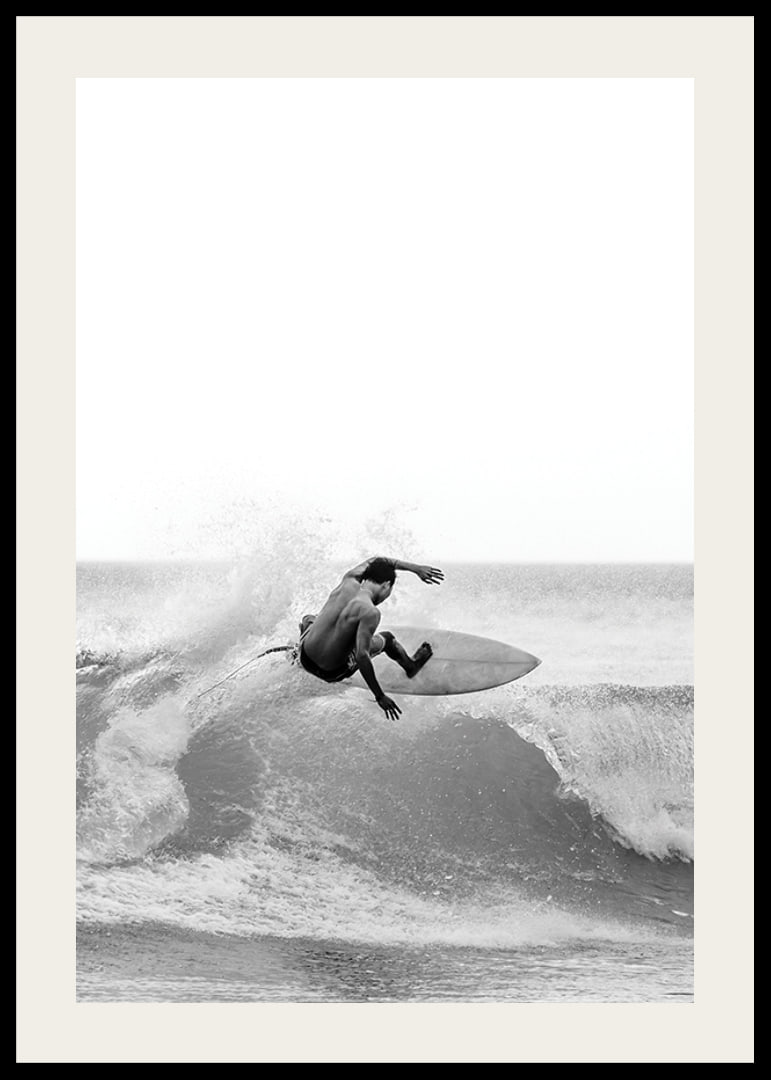 Black and white surfer caught in the middle of a wave jump-12