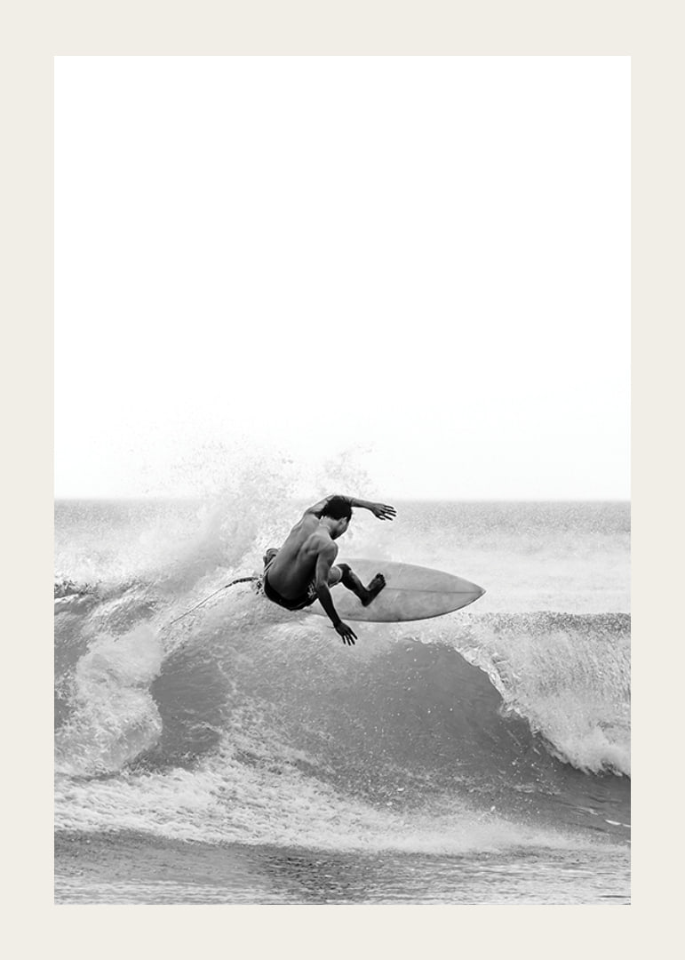 Black and white surfer caught in the middle of a wave jump-12