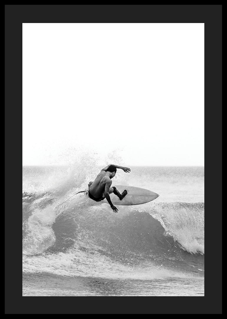Black and white surfer caught in the middle of a wave jump-12