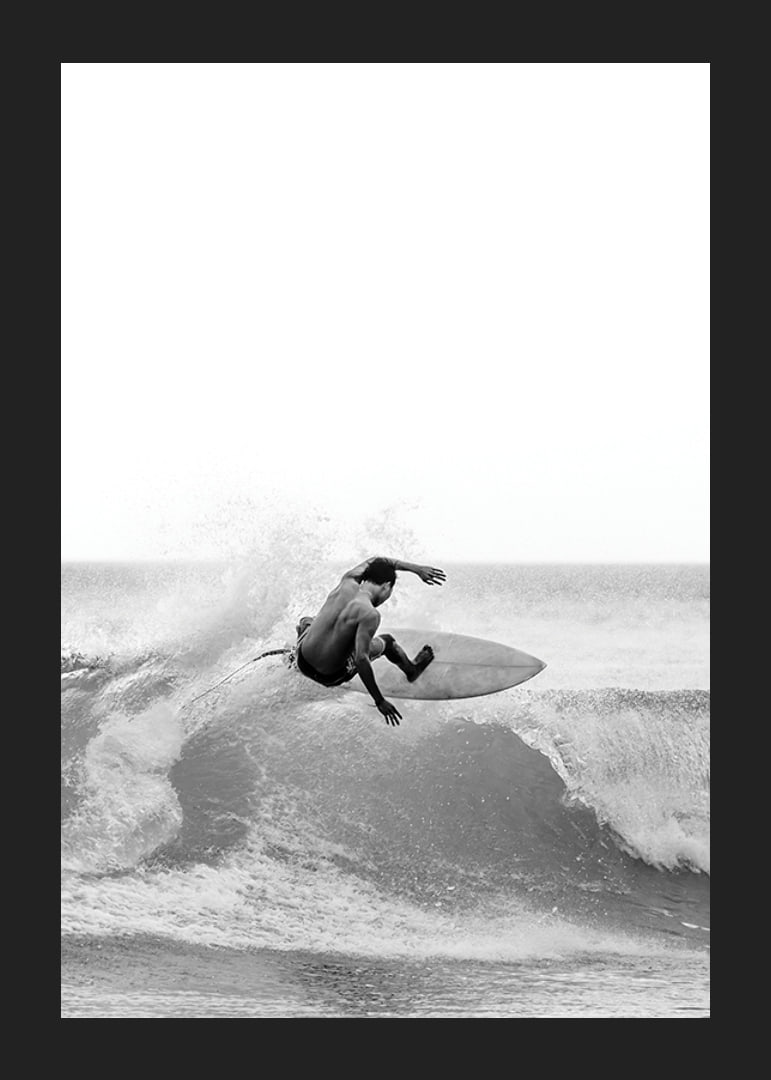 Black and white surfer caught in the middle of a wave jump-12