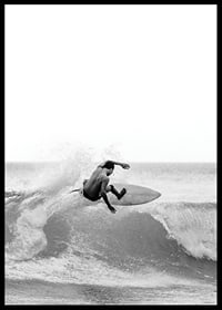Black and white surfer caught in the middle of a wave jump-6