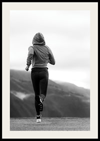 Black and white photographed woman running outdoors with mountains in the background-2