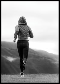 Black and white photographed woman running outdoors with mountains in the background-6