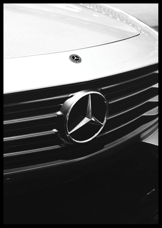 Black and white close-up of Mercedes grille with emblem in focus-12