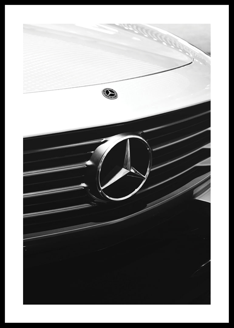 Black and white close-up of Mercedes grille with emblem in focus-12