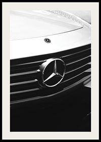 Black and white close-up of Mercedes grille with emblem in focus-2