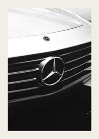 Black and white close-up of Mercedes grille with emblem in focus-3