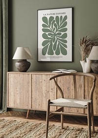 Graphic illustration of green leaf shapes on beige background-2