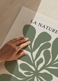 Graphic illustration of green leaf shapes on beige background-3