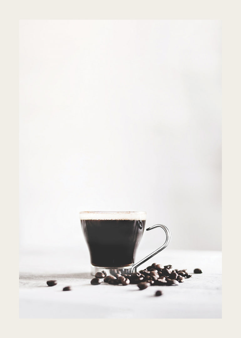 Photographic close-up of coffee glass and coffee beans, light background-12