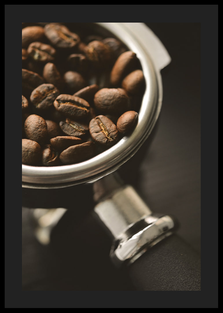 Photograph of espresso machine portafilter with coffee beans-12