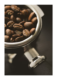 Photograph of espresso machine portafilter with coffee beans-1