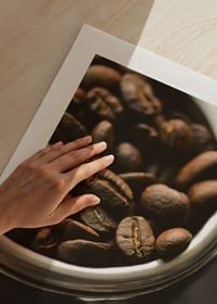 Photograph of espresso machine portafilter with coffee beans-9