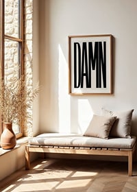 Graphic text with the word DAMN in black capital letters-8