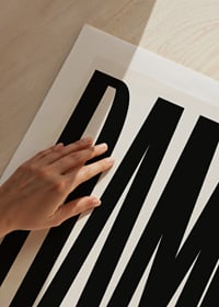 Graphic text with the word DAMN in black capital letters-9