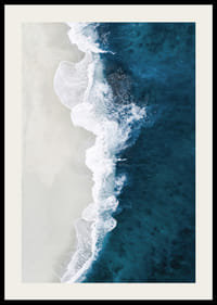 Ocean waves crashing against bright sandy beach, aerial view in blue and white-2