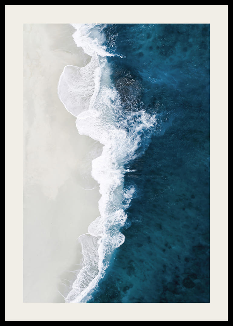 Ocean waves crashing against bright sandy beach, aerial view in blue and white-12