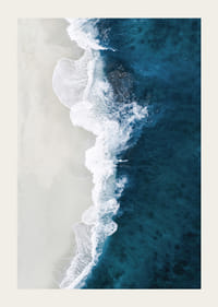 Ocean waves crashing against bright sandy beach, aerial view in blue and white-3