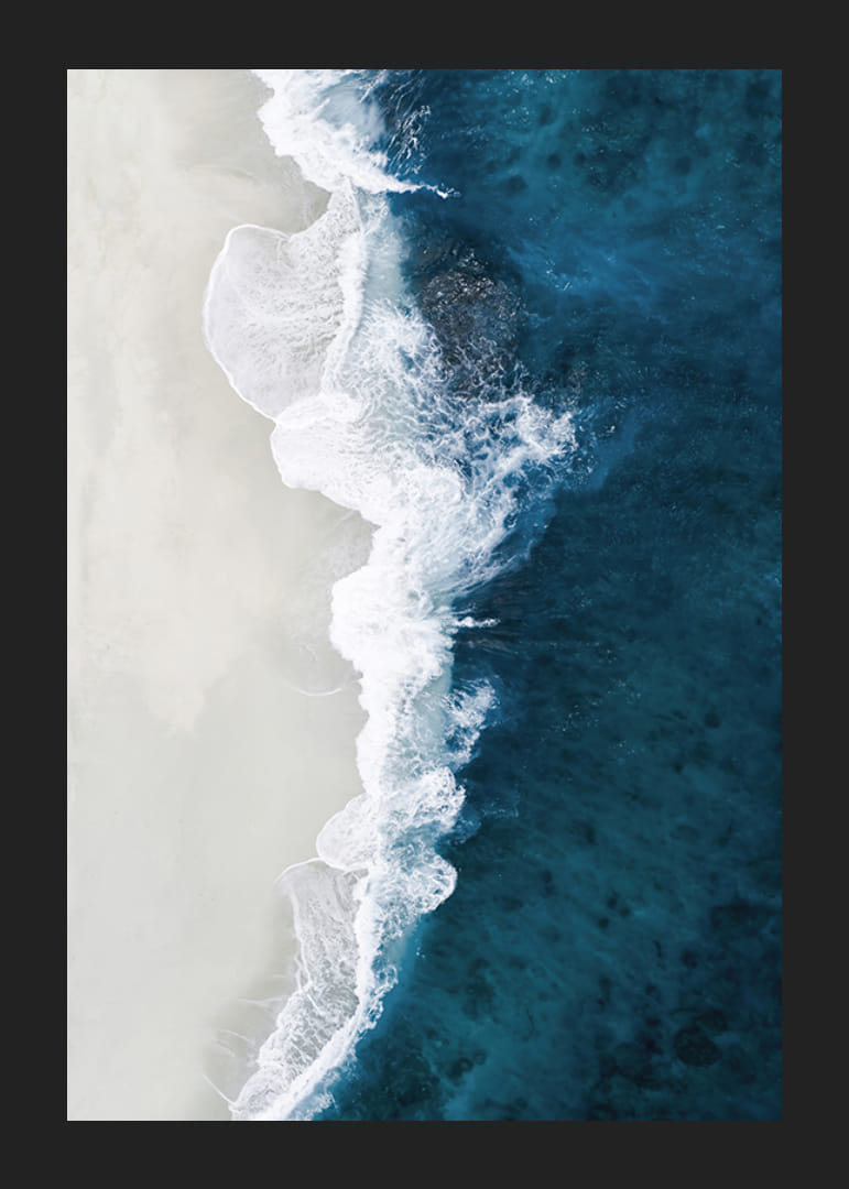 Ocean waves crashing against bright sandy beach, aerial view in blue and white-12